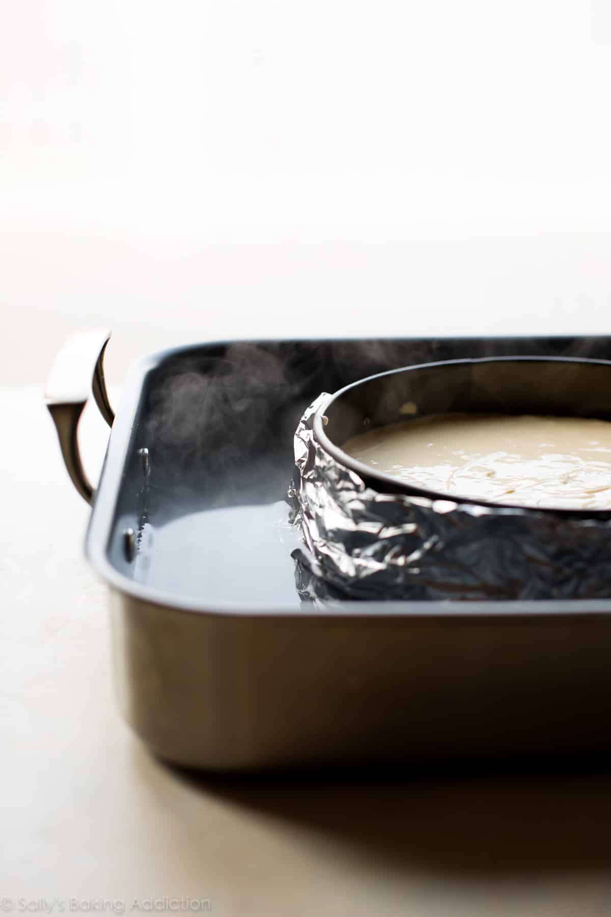 cheesecake pan wrapped in foil and placed in large pan with water